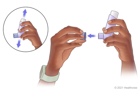 Person shaking inhaler, then taking cap off inhaler mouthpiece. Person shaking inhaler, then taking cap off inhaler mouthpiece.