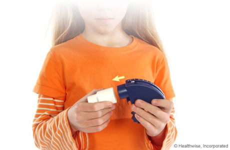 A child attaching a mouthpiece to the peak flow meter. A child attaching a mouthpiece to the peak flow meter.