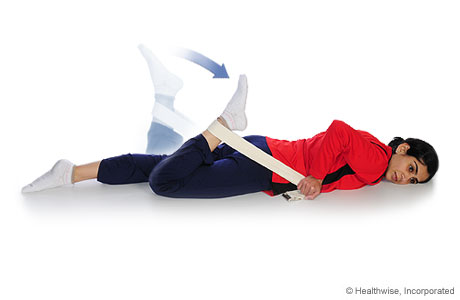 A person doing a quadricep stretch (face down). A person doing a quadricep stretch (face down).